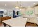 Stylish kitchen with a large island, farmhouse sink, and easy access to the living room and outdoor patio at 2295 Abbey Cove Ct, Marietta, GA 30062