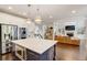 Open kitchen featuring stainless steel appliances and a view into the living room and fireplace at 2295 Abbey Cove Ct, Marietta, GA 30062
