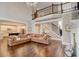 Open-concept living room with a cozy fireplace and views of the kitchen and staircase at 2295 Abbey Cove Ct, Marietta, GA 30062