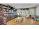Basement playroom featuring custom shelves with many books and toys at 2295 Abbey Cove Ct, Marietta, GA 30062