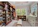 Spacious walk-in closet with custom shelving, drawers, and ample storage space for an organized wardrobe at 2295 Abbey Cove Ct, Marietta, GA 30062