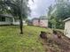 The backyard has mature trees, grass, and a storage shed at 4125 N Dearing Ne St, Covington, GA 30014