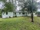 The backyard features a mix of grass and mature trees providing shade at 4125 N Dearing Ne St, Covington, GA 30014