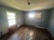 Bedroom with hardwood flooring offers ample space for renovation at 4125 N Dearing Ne St, Covington, GA 30014
