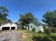Exterior view of the property including the home and garage at 4125 N Dearing Ne St, Covington, GA 30014