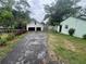 Detached two-car garage with a long driveway on the side of the home at 4125 N Dearing Ne St, Covington, GA 30014