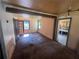An open living room with dark wood floors and French doors offering natural light at 4125 N Dearing Ne St, Covington, GA 30014