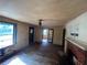 Spacious living room featuring a fireplace, hardwood floors, and natural light from the windows at 4125 N Dearing Ne St, Covington, GA 30014
