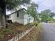 Home exterior featuring a concrete foundation and some landscaping at 4125 N Dearing Ne St, Covington, GA 30014