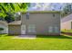 Well-maintained backyard with green grass and a small patio at 711 Ashley Ln, Stone Mountain, GA 30087