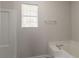 This bathroom includes a tub with shower and window at 711 Ashley Ln, Stone Mountain, GA 30087