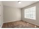 The bedroom has carpeted floors and a window for natural light at 711 Ashley Ln, Stone Mountain, GA 30087