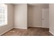 Bedroom featuring neutral walls, carpet, and a window at 711 Ashley Ln, Stone Mountain, GA 30087