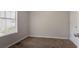 Cozy bedroom with a window, plush carpet, and closet space at 711 Ashley Ln, Stone Mountain, GA 30087