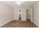 Bedroom featuring carpeted floors, multiple doors, and neutral walls at 711 Ashley Ln, Stone Mountain, GA 30087