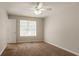 Bedroom featuring carpeted floors, ceiling fan, and neutral walls at 711 Ashley Ln, Stone Mountain, GA 30087