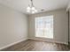 Well-lit dining area featuring a chandelier and large window for natural light at 711 Ashley Ln, Stone Mountain, GA 30087