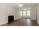 Inviting living room featuring a fireplace, hardwood floors, and plenty of natural light at 711 Ashley Ln, Stone Mountain, GA 30087