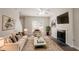 Inviting living room with fireplace, large window, ceiling fan and neutral decor at 711 Ashley Ln, Stone Mountain, GA 30087