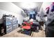 Attic bedroom with carpeted floors and overhead storage with a red folding chair at 7270 Williamsburg Dr, Riverdale, GA 30274