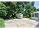 Spacious backyard features a storage shed and a large patio, perfect for outdoor entertaining at 2550 Laurel Ridge Dr, Decatur, GA 30033