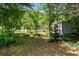 Expansive backyard offering privacy and ample space, complemented by a storage shed at 2550 Laurel Ridge Dr, Decatur, GA 30033