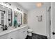 Bathroom with double sinks, and a glass enclosed shower with black hardware and subway tile surround at 2550 Laurel Ridge Dr, Decatur, GA 30033