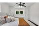 Bright bedroom features a ceiling fan, built-in bench and closet storage, and windows at 2550 Laurel Ridge Dr, Decatur, GA 30033