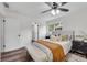 Bright bedroom features a ceiling fan, built-in bench and closet storage, and windows at 2550 Laurel Ridge Dr, Decatur, GA 30033