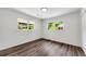 Bright bedroom featuring hardwood floors and natural light from two large windows at 2550 Laurel Ridge Dr, Decatur, GA 30033
