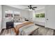 Bright bedroom features a ceiling fan, built-in bench and closet storage, and windows at 2550 Laurel Ridge Dr, Decatur, GA 30033