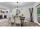 Dining area showcasing modern chandelier, stylish decor, and easy access to the kitchen at 2550 Laurel Ridge Dr, Decatur, GA 30033