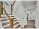 Entryway featuring wooden stairs with steel cable railings and sleek wood floors at 2550 Laurel Ridge Dr, Decatur, GA 30033