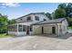 Charming two-story home with a carport and sunroom at 2550 Laurel Ridge Dr, Decatur, GA 30033