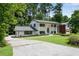 Beautiful two-story brick home with manicured lawn, mature trees, and inviting curb appeal at 2550 Laurel Ridge Dr, Decatur, GA 30033