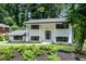 Charming two-story home with a well-manicured lawn and lush greenery, enhancing its curb appeal at 2550 Laurel Ridge Dr, Decatur, GA 30033