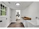 Bright laundry room with butcher block countertop, sink, and window to outside at 2550 Laurel Ridge Dr, Decatur, GA 30033