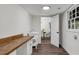 Well-lit laundry room with butcher block countertop, cabinets, sink, and window at 2550 Laurel Ridge Dr, Decatur, GA 30033