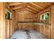 Interior view of the shed featuring a workbench, storage shelving, and windows at 2550 Laurel Ridge Dr, Decatur, GA 30033