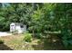 View of storage shed in the wooded backyard of the house at 2550 Laurel Ridge Dr, Decatur, GA 30033