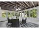 Charming sunroom featuring many windows, a ceiling fan, and black and white furniture at 2550 Laurel Ridge Dr, Decatur, GA 30033