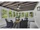 Cozy sunroom with multiple windows, exposed ceiling, and modern decor at 2550 Laurel Ridge Dr, Decatur, GA 30033