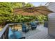 Inviting outdoor space with modern seating, a shady umbrella, and views of a fenced backyard at 428 Gold Xing, Canton, GA 30114