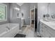 Well-appointed bathroom with a soaking tub, double vanities, and stylish fixtures at 428 Gold Xing, Canton, GA 30114
