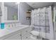 Upgraded bathroom with a white vanity, a modern sink, and a fun shower curtain at 428 Gold Xing, Canton, GA 30114