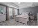 Bedroom with neutral decor, carpet, a queen-sized bed, and an abundance of natural light at 428 Gold Xing, Canton, GA 30114