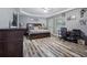 Spacious bedroom with hard surface floors, large bed, a closet, and a large desk at 428 Gold Xing, Canton, GA 30114