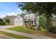 Charming home with a manicured front yard, two-car garage, and welcoming front porch at 428 Gold Xing, Canton, GA 30114