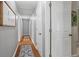 Hallway with hardwood floors and white doors at 428 Gold Xing, Canton, GA 30114