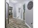 Hallway with wood-look flooring, neutral walls, and easy access to the bath and bedrooms at 428 Gold Xing, Canton, GA 30114